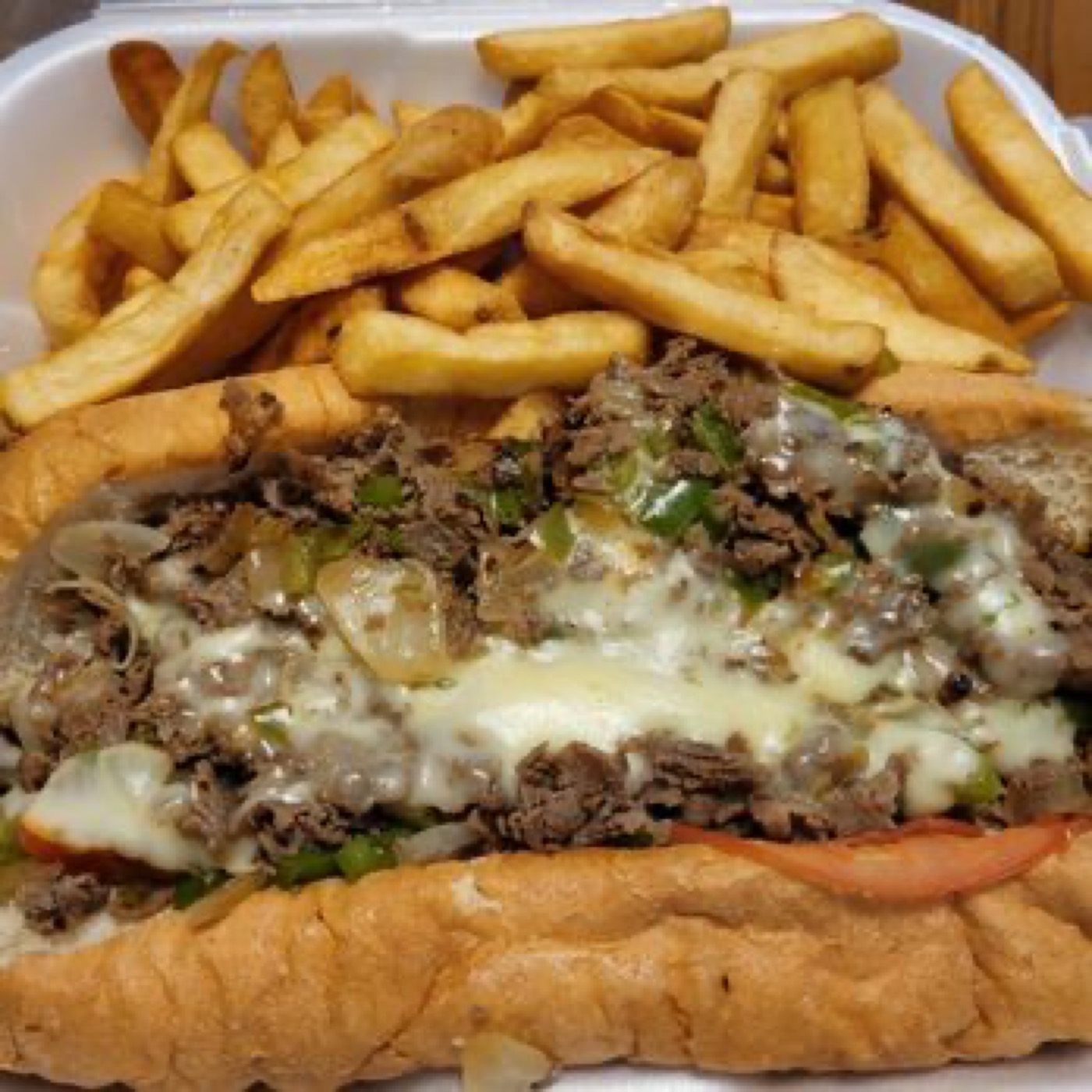 Chicken Latino's steak and cheese sub with a generous pile of french fries